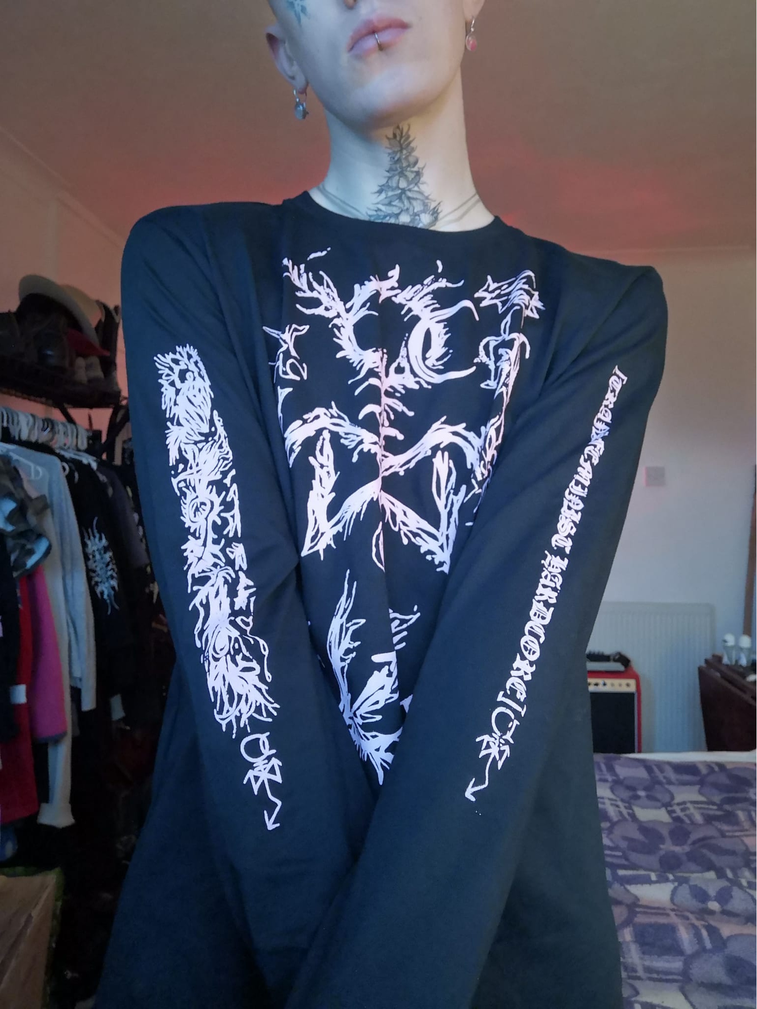 Long sleeved brick tee showing designs on the arms